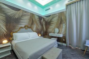 a bedroom with a bed and a wall with palm leaves at Antiqua Domus in Rome