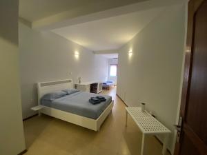 Una cama o camas en una habitación de Residencial Alto do Fortim