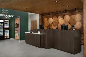a store with a bunch of wood logs on the wall at Fairfield by Marriott Inn & Suites Portland Newberg in Newberg