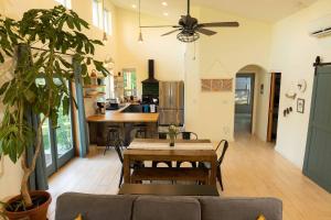 a living room with a table and a kitchen at Trailside vacation home—easy walk to Winthrop in Winthrop