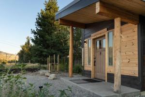 a small wooden building with a wooden door at Trailside vacation home—easy walk to Winthrop in Winthrop