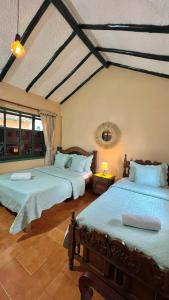 Postel nebo postele na pokoji v ubytování Hotel el laberinto