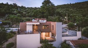 a house with a view of a mountain at Aeri in Prinos