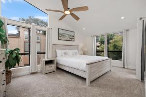 a bedroom with a bed and a ceiling fan at Tranquil Living - SUR4 in Solana Beach +34 photos