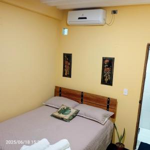 Rúm í herbergi á Hotel Gavas Amazonas