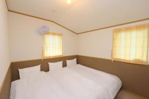 Postel nebo postele na pokoji v ubytování Hill House A NakaFurano Hokkaido
