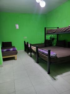 Postel nebo postele na pokoji v ubytování Hostal Tequila