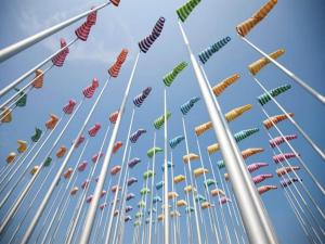 a group of many different colored windsocks in the sky at Apartment on Belgian Coast with Sea View in De Haan