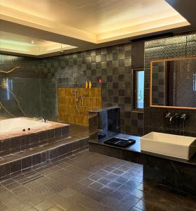 Koupelna v ubytování Her Home Spa Motel Douliu