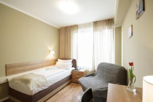 Postel nebo postele na pokoji v ubytování Hotel Pankow + 30 fotografií