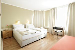 Postel nebo postele na pokoji v ubytování Hotel Pankow