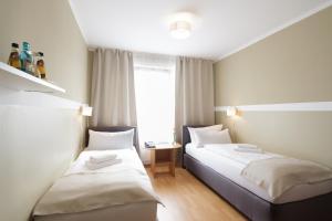 Postel nebo postele na pokoji v ubytování Hotel Pankow