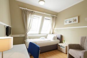 Postel nebo postele na pokoji v ubytování Hotel Pankow