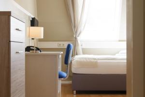 Postel nebo postele na pokoji v ubytování Hotel Pankow
