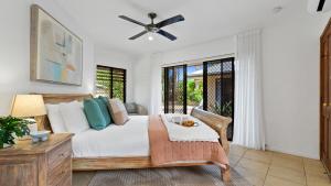 Letto o letti in una camera di The Pavilion at Trinity Beach
