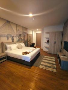 Postel nebo postele na pokoji v ubytování Bright Hotel