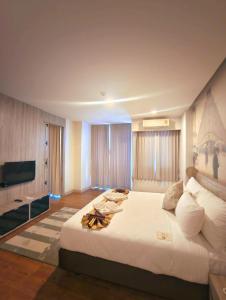 Postel nebo postele na pokoji v ubytování Bright Hotel