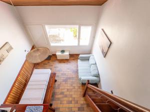 an attic room with two beds and a window at Mimizan Plage Sud : Bel appartement pour 4, proche océan, parking privatif - Ménage inclus - FR-1-50-183 in Mimizan