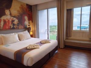 Postel nebo postele na pokoji v ubytování Bright Hotel