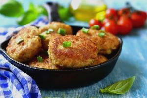 a black bowl filled with meatballs with green onions at FabHotel Golden Heights in Hinjewadi +30 photos