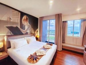 Postel nebo postele na pokoji v ubytování Bright Hotel