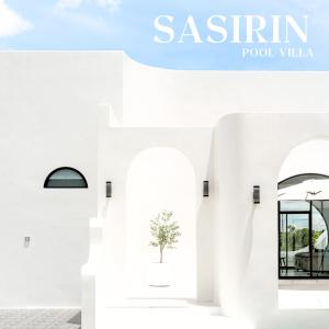 a catalogue of a white building with a plant in a vase at Sasirin Pool Villa 