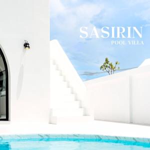 a white staircase next to a swimming pool at Sasirin Pool Villa 
