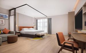 Postel nebo postele na pokoji v ubytování Hilton Garden Inn Xingyi Orange Hill Plaza