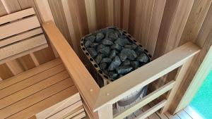an overhead view of a sauna with rocks in it at Nine Valley Park in Boeun