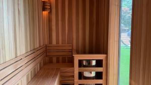 a sauna with a bench next to a window at Nine Valley Park in Boeun