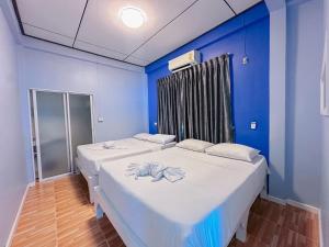 Postel nebo postele na pokoji v ubytování Baan Talay Home Jomtien Beach