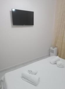 Ένα ή περισσότερα κρεβάτια σε δωμάτιο στο APARTMENT PEREA THESSALONIKI