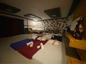 Postel nebo postele na pokoji v ubytování Tres Marias' Garden Resort, Resto and Sports Bar