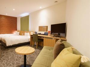 TV a/nebo společenská místnost v ubytování Sakura Garden Hotel