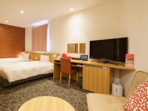 TV a/nebo společenská místnost v ubytování Sakura Garden Hotel