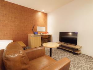 TV a/nebo společenská místnost v ubytování Sakura Garden Hotel