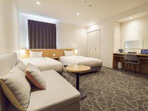 TV a/nebo společenská místnost v ubytování Sakura Garden Hotel