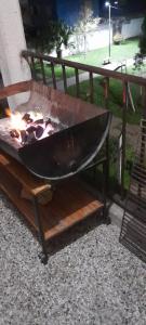 a large grill with a fire in it at Departamento PyA in San Miguel de Tucumán