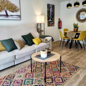 a living room with a couch and a table at Apartamento Leurtza in Doneztebe +24 photos