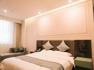 Giường trong phòng chung tại GEM Hotel Zibo Economic Development Zone Zibo Vocational Institute +183 ảnh