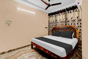 En eller flere senge i et værelse på Collection O Indira Gandhi Zoo Visakhapatnam