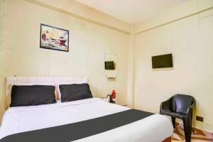 Ένα ή περισσότερα κρεβάτια σε δωμάτιο στο Collection O Shillong Lapalang Market