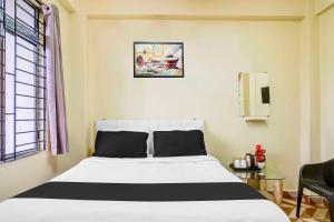 Ένα ή περισσότερα κρεβάτια σε δωμάτιο στο Collection O Shillong Lapalang Market