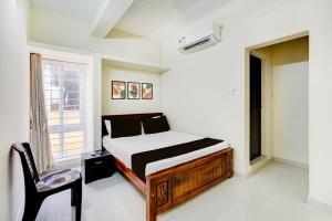 Postel nebo postele na pokoji v ubytování Collection O Sholinganallur Chennai Formerly Nimalan Residenc