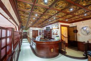 a large room with a bar in a building at The Amsterdam Hotel in Angeles