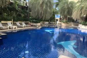 a swimming pool with a shark in the water at Elong Hotel Pattaya Jomtien Beach in Na Jomtien +43 photos