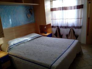 Säng eller sängar i ett rum på Villa Giulia