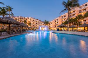 a large swimming pool in front of a hotel at Playa Linda Beach Resort in Palm-Eagle Beach +20 photos