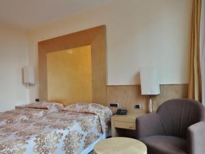 Posteľ alebo postele v izbe v ubytovaní Hotel Tiffany Milano