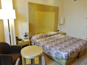 Posteľ alebo postele v izbe v ubytovaní Hotel Tiffany Milano